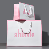 Sac en papier rose de couleur de marque de fond fabriqué en usine impression Logo Design ruban poignée sac à provisions