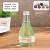 Vente en gros 100ml 200ml 250ml 350ml 500ml écorce d'orange gaufrage bouteille ronde en verre de jus de fruits vin liqueur avec bouchons en aluminium