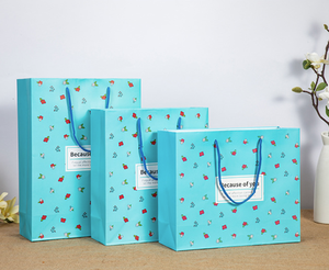 ถุงกระดาษสีขาวพิมพ์ลายตามสั่ง หรูหรา ทนทาน เป็นมิตรกับสิ่งแวดล้อม พับเก็บได้ ใช้ซ้ำได้ พร้อมหูหิ้วริบบิ้น - Product Image 2