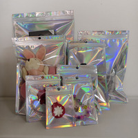 Emballage pour jouets en peluche en plastique laminé OPP, avec fermeture éclair transparente sur le devant, différentes tailles, dos holographique brillant, imprimé par gravure et film laser
