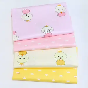 Kindergarten baby cloth cartoon dog crown printed cotton twill fabric environment-friendly printing and dyeing fabric