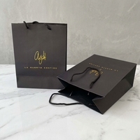 Quantité minimum de commande : 100 pièces |   Conception Gratuite |   Sac de shopping en papier pour bijoux de luxe blanc/noir, carton artistique 250 g/m², logo personnalisé avec poignée