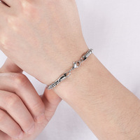 Bracelet rétro punk en acier inoxydable pour hommes, avec tête de fantôme, chaîne réversible double face, fermoir tête de mort, style streetwear tendance