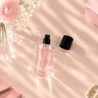 Vente en gros de flacons atomiseurs de parfum en verre transparent épais de 50 ml, design à épaule ronde, impression personnalisée pour l'emballage cosmétique