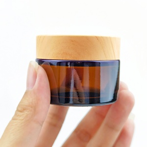 Factory Price and High Quality Tawny Frosted Black Amber <b>Glass</b> Cosmetic Cream <b>Jar</b> <b>with</b> <b>Wood</b> Grain <b>Lid</b> Lotion for Face Cream - Product Image 1
