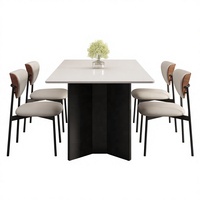 Table à manger moderne minimaliste avec plateau en marbre, pieds en métal et base géométrique en forme d'anneau, durable et écologique