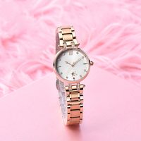 Montre à quartz pour femme élégante et luxueuse en or rose, incrustation de cristaux, bracelet en acier inoxydable, cadran avec date, fermoir papillon - Résistance à l'eau 30 m