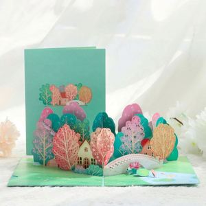 Cartes de vœux pop-up personnalisées faites à la main avec des arbres et un pont - Product Image 1