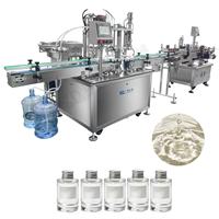 Machine intégrée automatique de mise en bouteille, de pose de capuchons et d'étiquetage pour le conditionnement de produits cosmétiques, d'huiles essentielles, de lotions et de crèmes