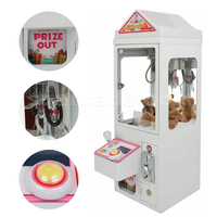 Jeu d'arcade de bonbons à jetons en gros d'usine Mini machine à griffes bon marché pour la Malaisie Petite machine à griffes de grue jouet