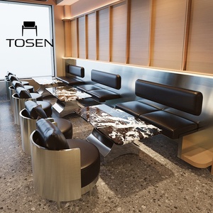 Bar-café de style industriel avec comptoir en granit et ensembles de chaises pour réunions d'affaires et canapés de détente - Product Image 1