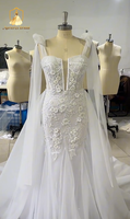 Robe de mariée sirène moderne ZB5839 avec décolleté plongeant, dos nu, cape transparente, bretelles, broderies florales, dentelle florale 3D et tulle, traîne chapelle