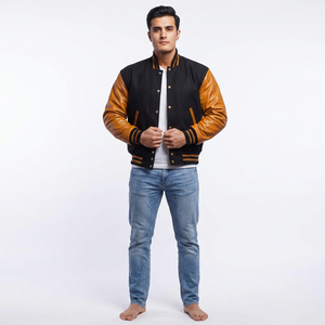 Chaqueta estilo universitario para hombre en negro y marrón, mangas estilo cuero, forro acolchado, ribete a rayas, botones a presión, abrigo de moda urbana. - Product Image 1