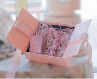 Portefeuille de luxe tasse de bouteille d'aromathérapie boîte d'emballage cadeau boîte de bonbons rose en papier de carton rigide avec ruban