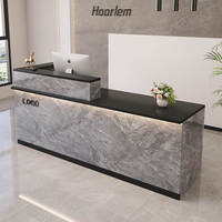 Comptoir de réception multifonctionnel en pierre grise, personnalisable avec logo, de grande taille, ergonomique, modulaire et respectueux de l'environnement