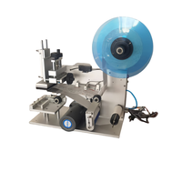 Machine d'application d'étiquettes semi-automatique de haute précision pour sachets Doypack et surfaces planes supérieures de bouteilles de boissons
