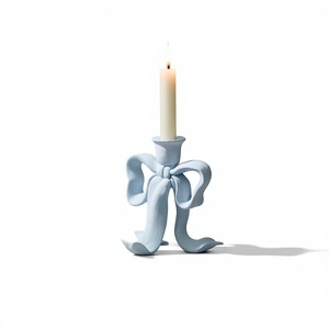 Elegant <b>Ribbon</b> Bow Light Blue Metal Taper Stand Texture Casting Table Centerpiece Supplier - Product Image 1