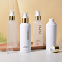 Bouteille vide de lotion de pompe en plastique de shampooing blanc givré cosmétique de 200ml avec la pompe de lotion d'or