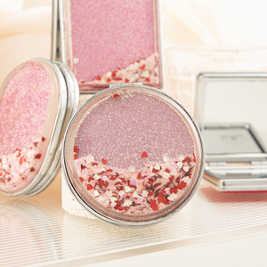 Mini miroir compact rond rose à paillettes flottantes en forme de cœur, double face, en verre HD, pliable, pour maquillage, vente en gros - Product Image 1