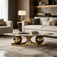 Table basse ovale de luxe moderne en marbre avec base sphérique en acier inoxydable, table de salon design pour villa et appartement