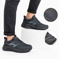Baskets basses athlétiques à semelle épaisse avec empeigne synthétique texturée, semelle intermédiaire ondulée et semelle à crampons, noires, pour hommes, chaussures décontractées