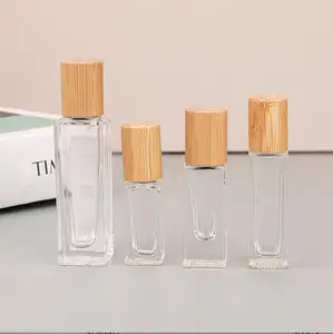 Bambu kap veya ahşap gibi kap paslanmaz çelik silindir şişe ile 5ml 10ml 15ml çakmaktaşı cam rulo şişe