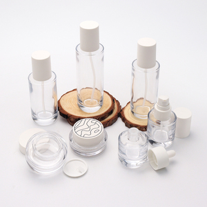 Emballage de soins de la peau transparent en gros, cylindre transparent vide, flacon pompe en verre pour sérum et lotion de 150, 120, 100 ml avec bouchon blanc - Product Image 1
