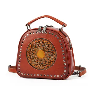 Wholesale Vintage Style Round Hole Totem Design Embossed Cross body Top Handle Genuine Leather Handbags For Women Shoulder Bag