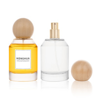 Flacon de parfum rechargeable en verre transparent 30ml 50ml 100ml avec boîte cadeau rigide ronde de luxe pour une image de marque de parfum haut de gamme