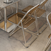Ensemble de salle à manger de style industriel avec table carrée en acier inoxydable embossé + chaise pliante transparente ambrée
