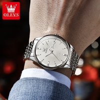 Montre mécanique automatique OLEVS 6653 pour homme, design volant, étanche en profondeur, bracelet en acier inoxydable, verre saphir.