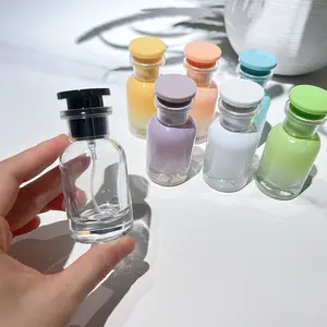 Bouteille ronde de parfum de luxe distributeur de cosmétiques bouteille d'emballage parfum vaporisateur forme de cylindre bouteilles en verre vides
