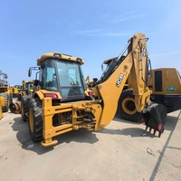 Chargeuse-pelleteuse JCB 4CX d'occasion en bon état, en stock, pour travaux de terrassement et de manutention de matériaux
