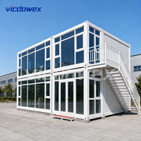 VICDOWEX Maison conteneur préfabriquée modulaire à deux étages, design Asie du Sud-Est, avec murs en panneaux sandwich pour entrepôt