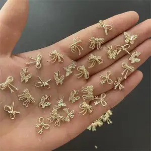 Amuleto de liga japonesa 3D para decoração de unhas, joia de luxo com borboletas e strass, acessório DIY, 100 peças