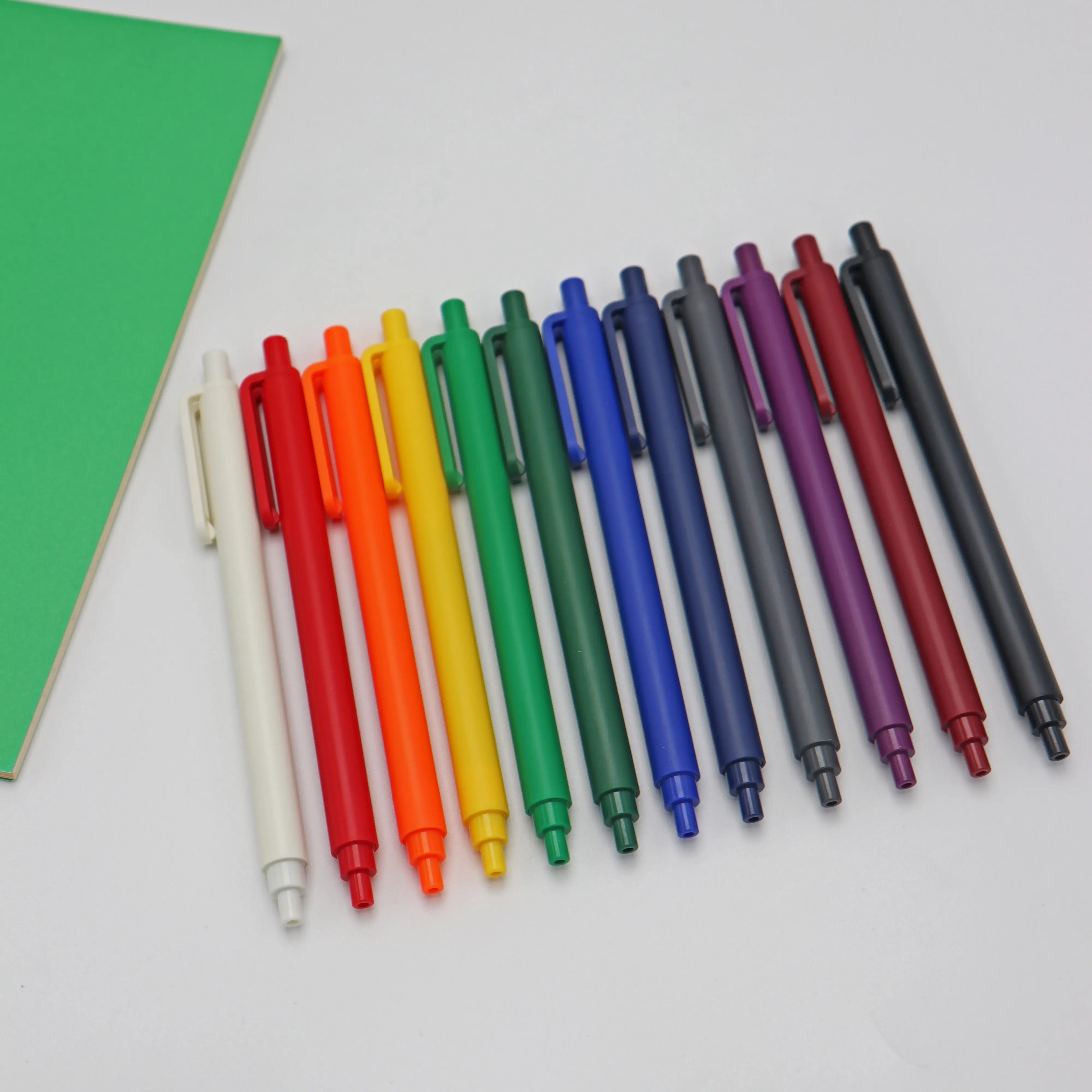 Promotional gel pens with logo matt finish ballpoint logo black pens wholesale pastel color pens custom with smile face clip