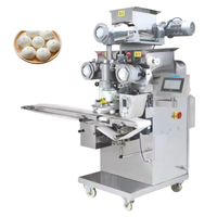 Machine de remplissage de pâte commerciale pour l'égyptien Aish Baladi avec fabricant de desserts farcis au pain sucré aux dattes