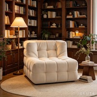Fauteuil moderne en tissu capitonné avec design modulaire rembourré en peluche pour salon de luxe et coin détente à domicile