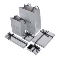 Sac en papier avec nœud papillon en argent portable haut de gamme pochette à bijoux emballage en carton boîte-cadeau