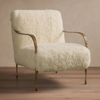 Fauteuil de salon sculptural avec accoudoirs en métal doré et pieds coniques pour salons et suites d'hôtel