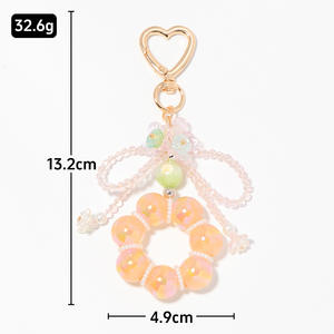 จี้กระเป๋าคริสตัลหลากสีประดับลูกปัดโลหะผสมสังกะสีรูปโบว์ดอกไม้สุดน่ารักสำหรับพวงกุญแจ - Product Image 3