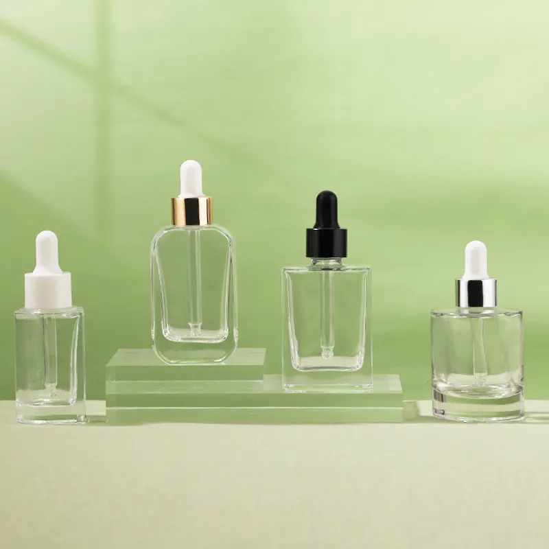 Bottiglie di vetro di lusso 1oz vetro trasparente per il corpo siero contagocce con vari colori tappo per pipetta di imballaggio cosmetico vuoto