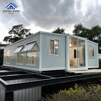 Casa Modular Expandible de Acero con Estructura en I, Acabado Gris Claro con Detalles Blancos, Puerta Corredera, Prefabricada, Reubicable, Almacén Listo para Usar, Hogar Moderno