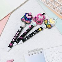 Stylo gel de décompression rotatif personnalisable pour filles 0.5mm perles de fleurs en plastique stylos à logo Instrument d'écriture bricolage