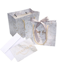 Emballage de boutique de vêtements en marbre moyen avec design de LOGO personnalisé Sac en papier cadeau avec ruban