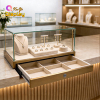 Petite vitrine de comptoir en métal doré avec éclairage LED intégré, écologique, pour présentation de montres et bagues en diamant en showroom