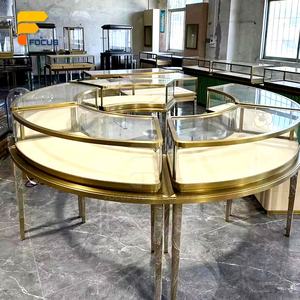 <span class=keywords><strong>Vitrine</strong></span> à bijoux ronde haut de gamme en verre, comptoir <span class=keywords><strong>d</strong></span>'exposition modulaire doré, aménagement intérieur de magasin de luxe - Product Image 1