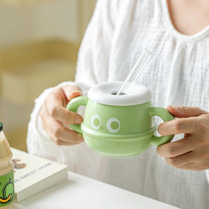 Mug en céramique mignon à motif de dessin animé avec couvercle, double poignée et paille, idéal pour les étudiants et les bureaux, design rentrée scolaire - Product Image 1