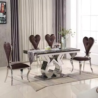 Ensemble de table à manger de luxe en acier inoxydable avec dessus en marbre pour appartement cuisine restaurant et salon