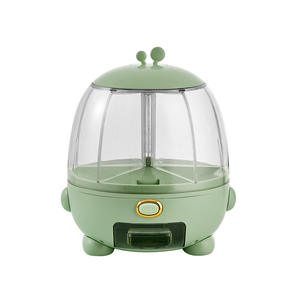 Conteneur de stockage de riz en forme d'œuf vert avec couvercle hermétique, compartiment rotatif et bouton-poussoir pour usage domestique - Product Image 3